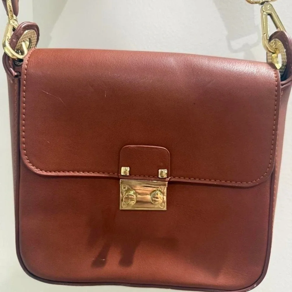 Brown leather crossbody bag with gold hardware